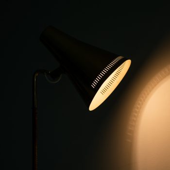Paavo Tynell floor lamps model K-10 in brass and cane at Studio Schalling