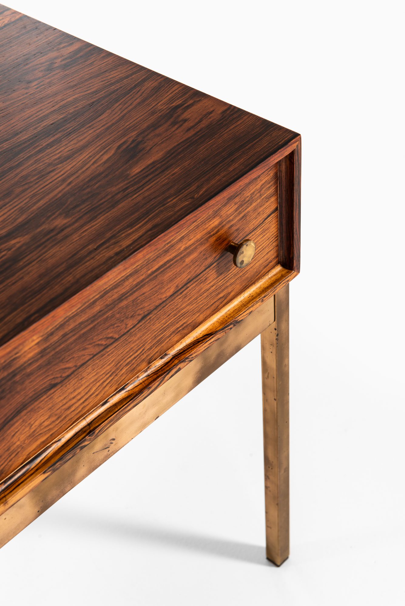 Poul Nørreklit side table in rosewood and brass at Studio Schalling