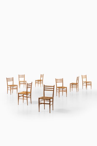 Set of 8 dining chairs in beech and seagrass at Studio Schalling
