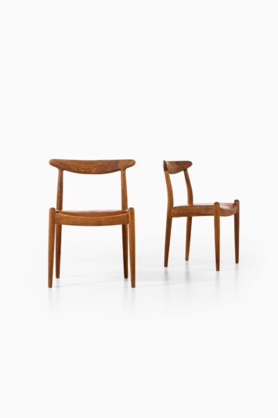 Hans Wegner W1 dining chairs in oak and leather at Studio Schalling