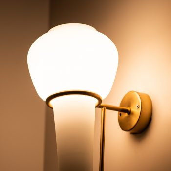 Hans-Agne Jakobsson V-24 wall lamps in brass and opaline glass at Studio Schalling