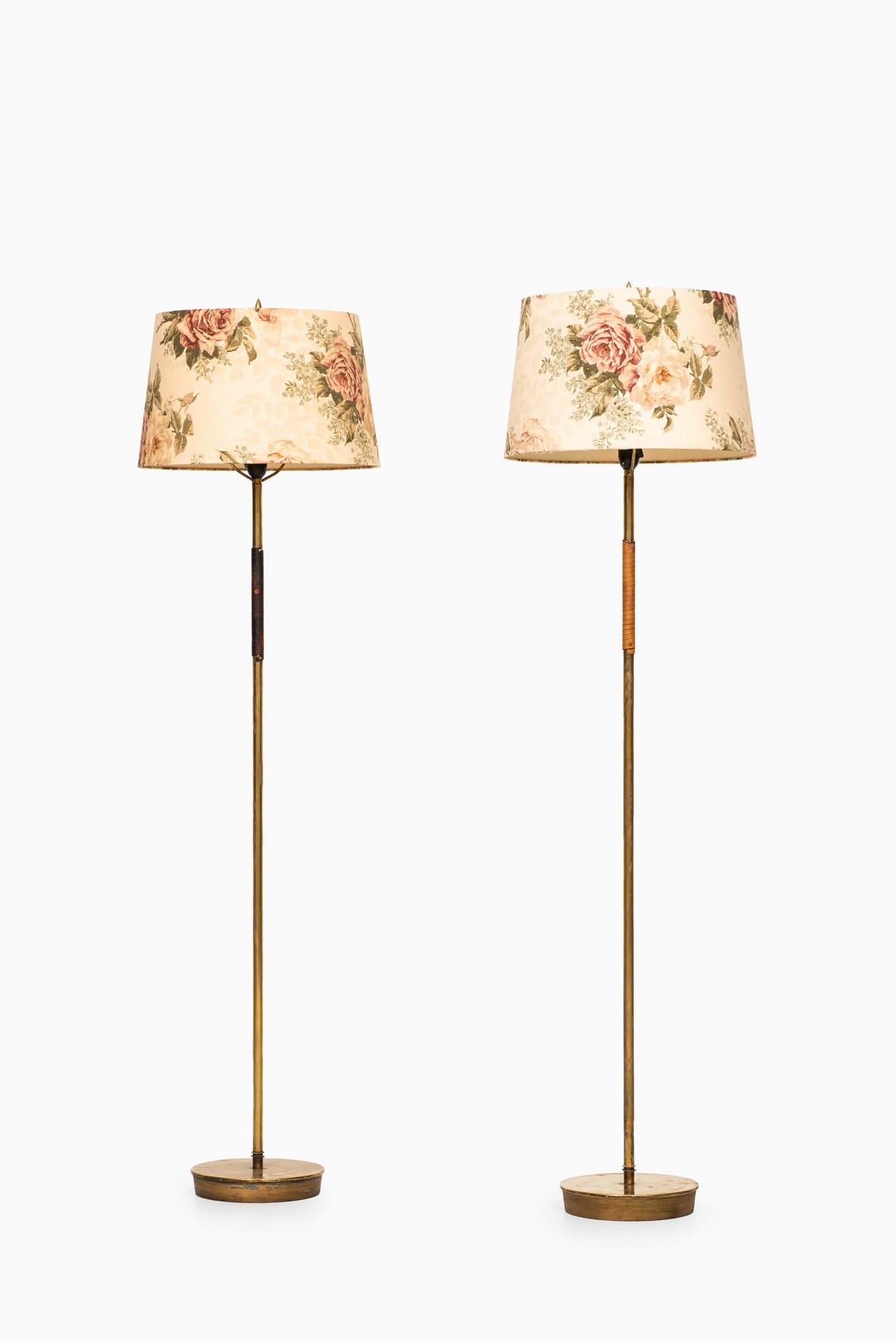 Pair of floor lamps attributed to Paavo Tynell at Studio Schalling