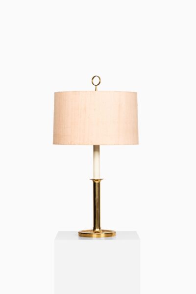 Pair of tall table lamps in brass at Studio Schalling