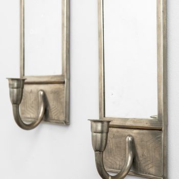 Wall candlesticks in pewter and brass at Studio Schalling