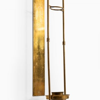 Wall candlestick in brass produced in Sweden at Studio Schalling