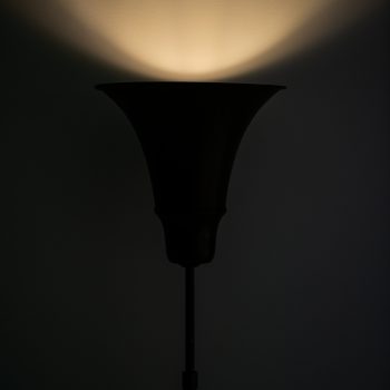 Height adjustable floor lamp / uplight by Louis Poulsen at Studio Schalling