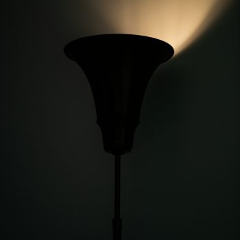 Height adjustable floor lamp / uplight by Louis Poulsen at Studio Schalling