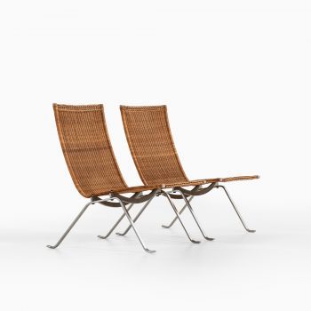 Poul Kjærholm PK-22 easy chairs in steel and rattan at Studio Schalling