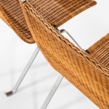 Poul Kjærholm PK-22 easy chairs in steel and rattan at Studio Schalling