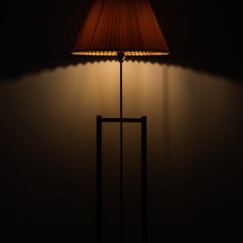 Pair of floor lamps in teak and brass at Studio Schalling