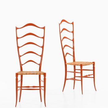 Side chairs in red lacquered wood and cane at Studio Schalling