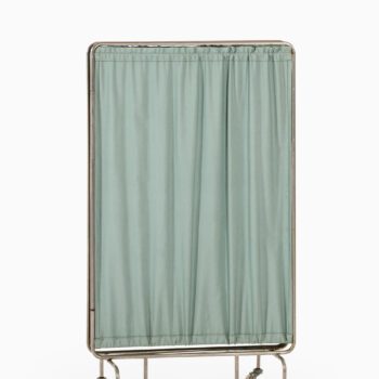 Room divider on wheels in steel and fabric at Studio Schalling