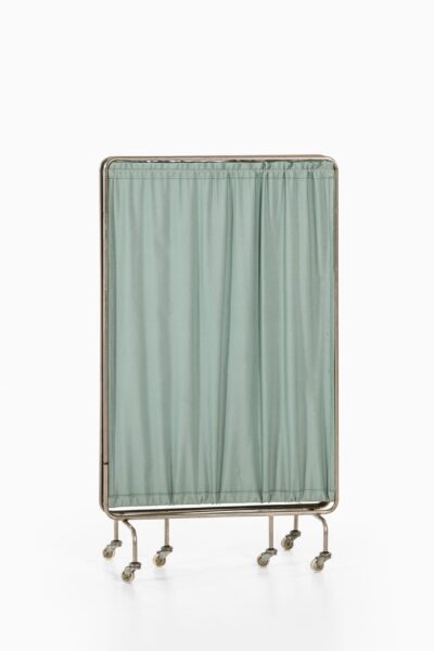 Room divider on wheels in steel and fabric at Studio Schalling