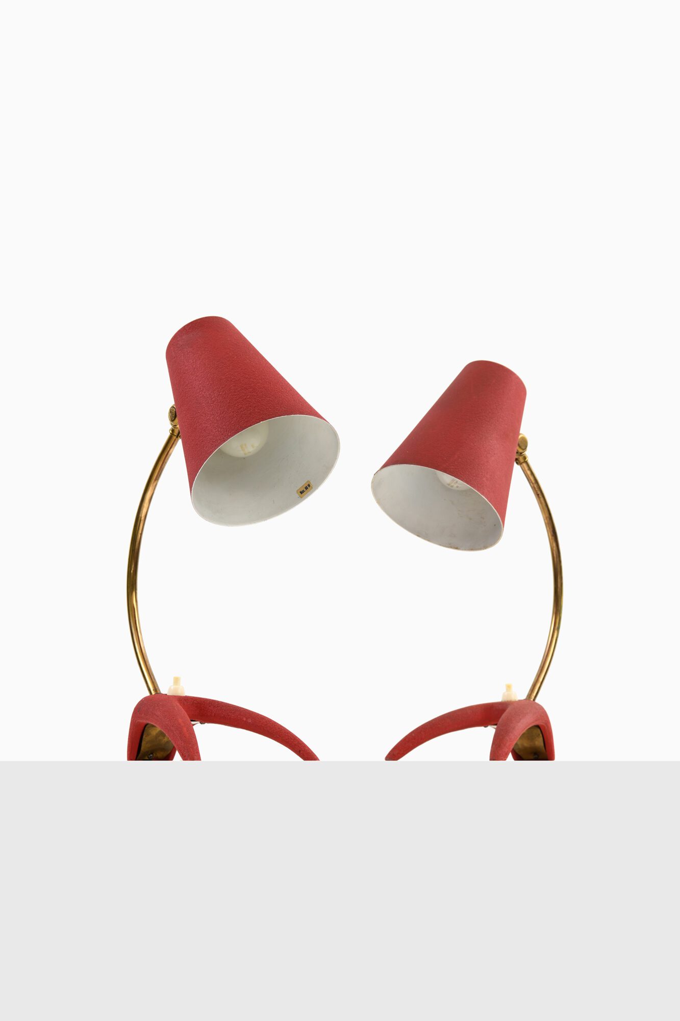 Table lamps in red lacquered metal at Studio Schalling