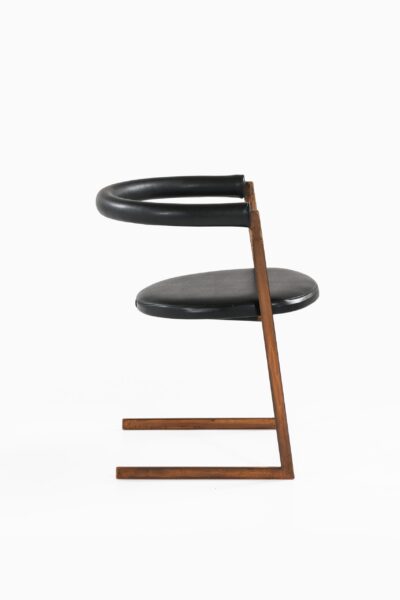 Dining chairs in bronze and black leather at Studio Schalling