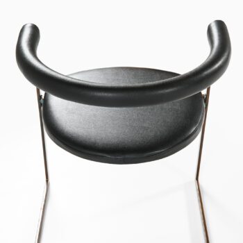 Dining chairs in bronze and black leather at Studio Schalling