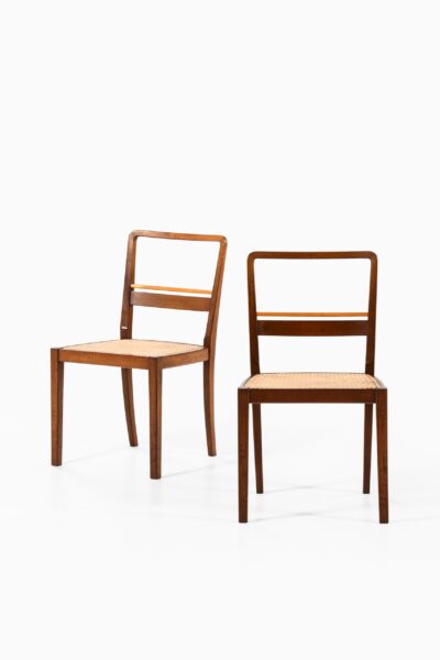 Erik Chambert dining chairs in mahogany at Studio Schalling