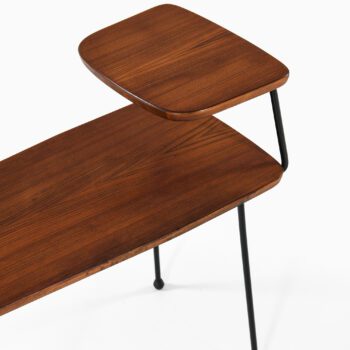 Side tables in teak and black lacquered metal at Studio Schalling