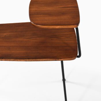 Side tables in teak and black lacquered metal at Studio Schalling