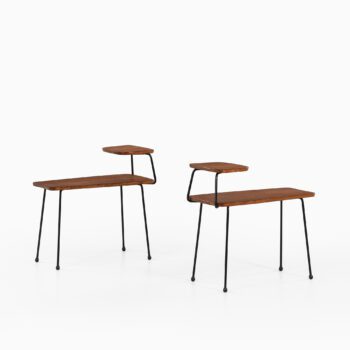 Side tables in teak and black lacquered metal at Studio Schalling