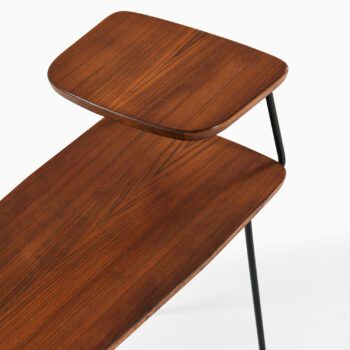Side tables in teak and black lacquered metal at Studio Schalling