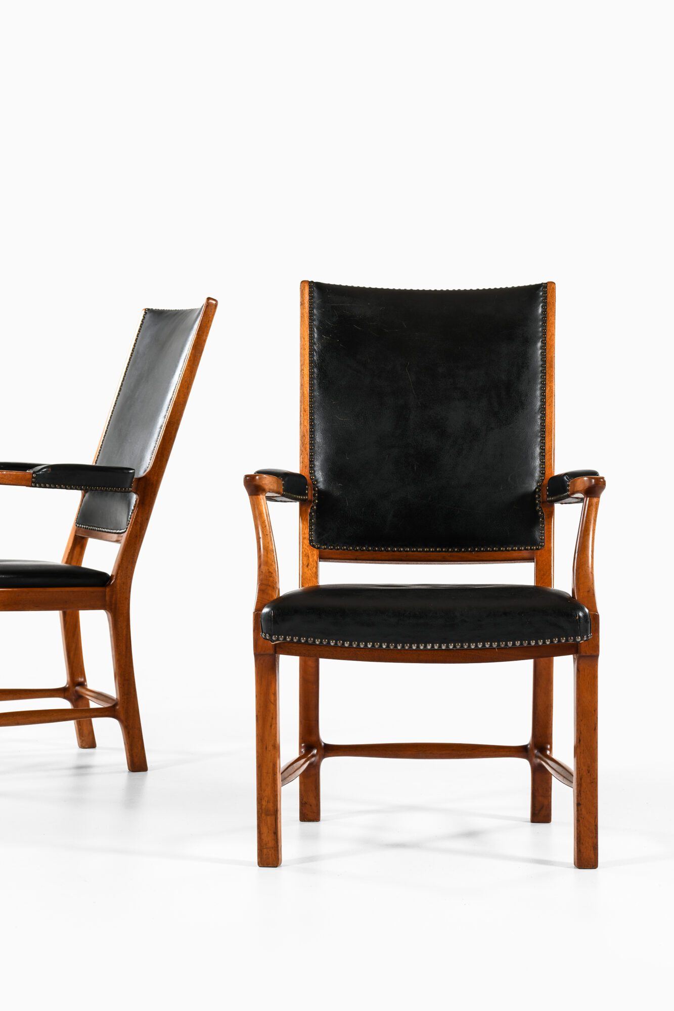 Erik Chambert armchairs in mahogany at Studio Schalling