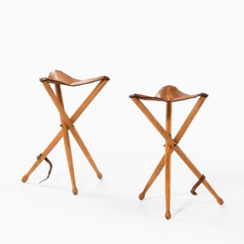 A pair of hunting stools in leather and beech at Studio Schalling