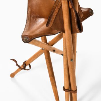 A pair of hunting stools in leather and beech at Studio Schalling