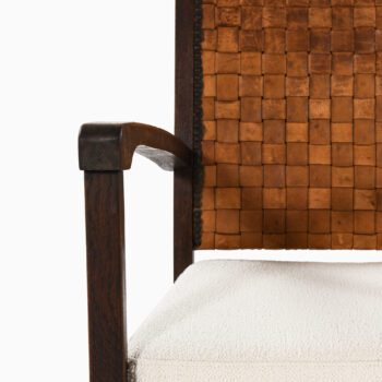 Easy chairs in dark stained oak and leather at Studio Schalling