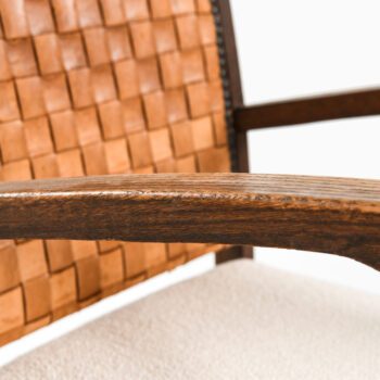Easy chairs in dark stained oak and leather at Studio Schalling