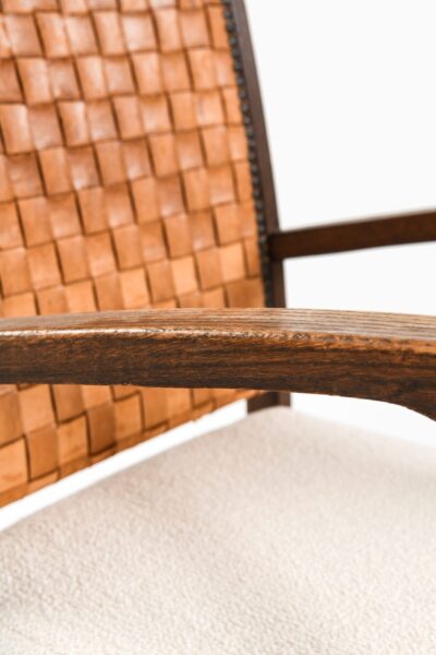 Easy chairs in dark stained oak and leather at Studio Schalling