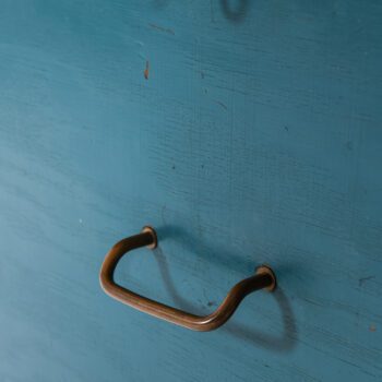 Desk in teak, brass and blue lacquer at Studio Schalling