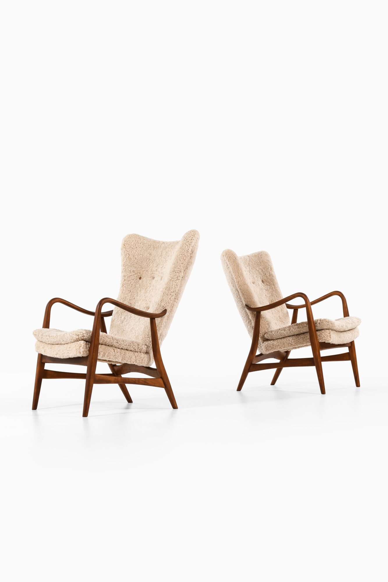 Easy chairs in beech and sheepskin at Studio Schalling