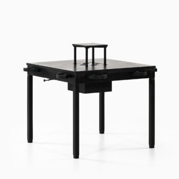 Game table in black lacquered wood at Studio Schalling