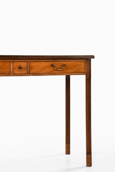 Console table in mahogany and brass at Studio Schalling