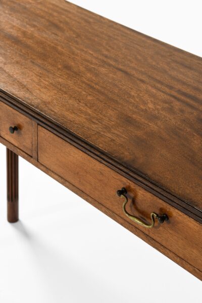 Console table in mahogany and brass at Studio Schalling