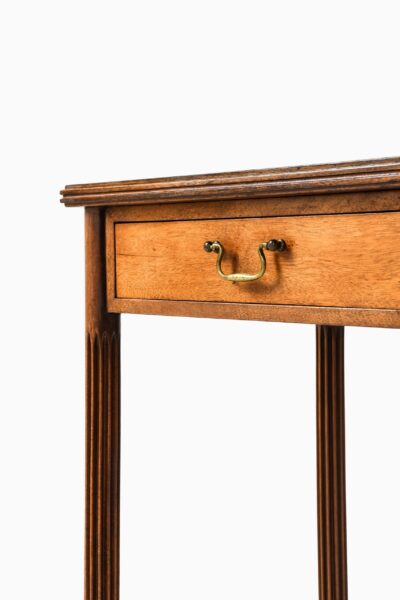 Console table in mahogany and brass at Studio Schalling