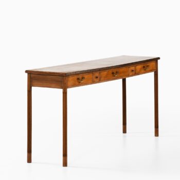 Console table in mahogany and brass at Studio Schalling