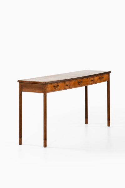 Console table in mahogany and brass at Studio Schalling