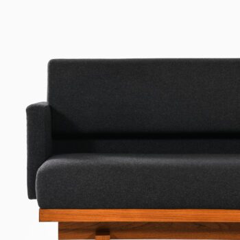 Sofa in mahogany and wool upholstery at Studio Schalling