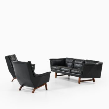 Sofa in rosewood and black leather at Studio Schalling