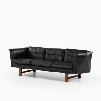 Sofa in rosewood and black leather at Studio Schalling