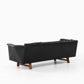 Sofa in rosewood and black leather at Studio Schalling