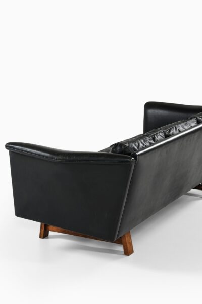 Sofa in rosewood and black leather at Studio Schalling