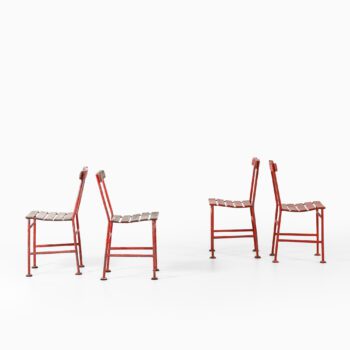 Gunnar Asplund chairs in red lacquered metal at Studio Schalling