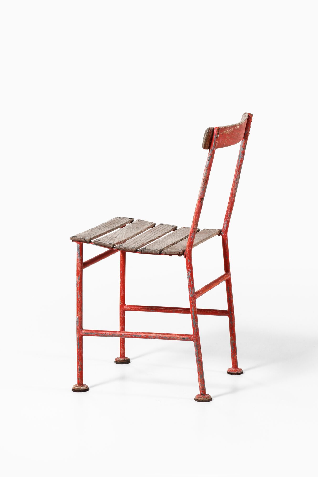 Gunnar Asplund chairs in red lacquered metal at Studio Schalling