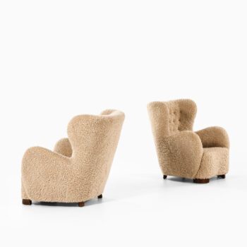 Pair of easy chairs in lambskin at Studio Schalling