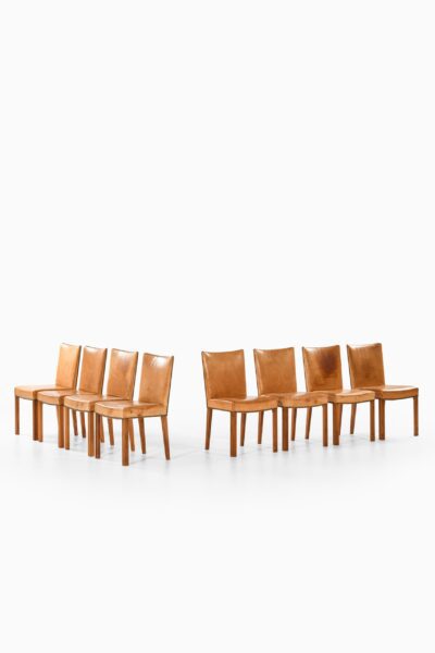 Dining chairs in walnut and leather at Studio Schalling