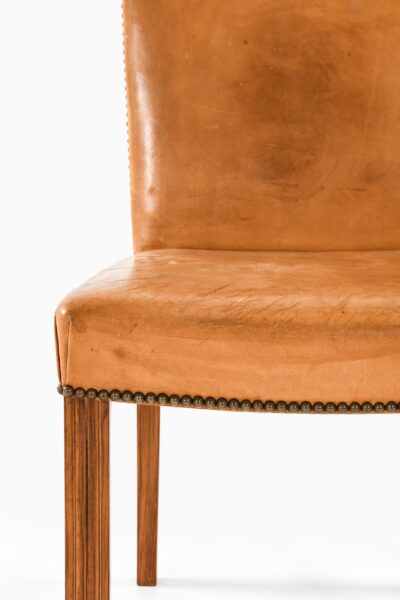 Dining chairs in walnut and leather at Studio Schalling