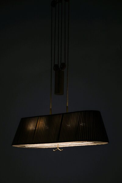 Height adjustable ceiling lamp by Böhlmarks at Studio Schalling